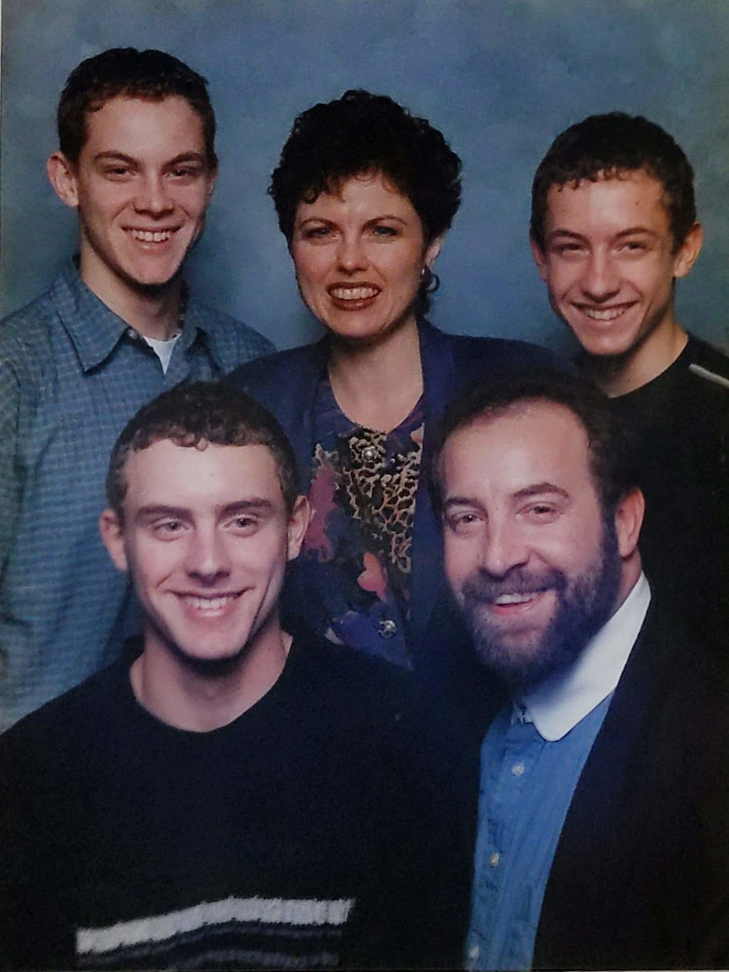 A family photo of Doug with his brothers and parents