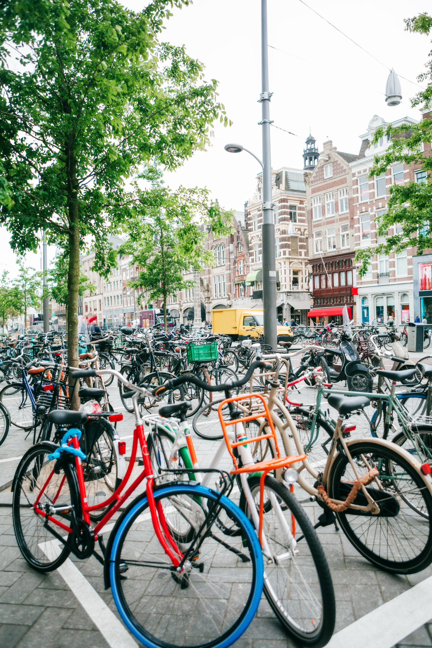 a ton of bikes parked on the street in Amsterdam