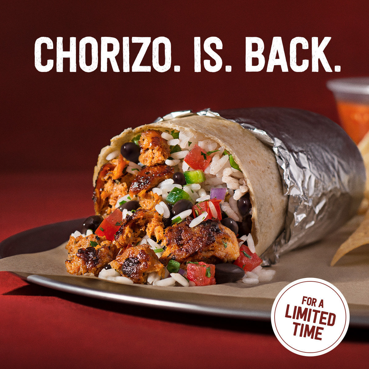chipotle burrito with the words &quot;chorizo is back&quot; over the image