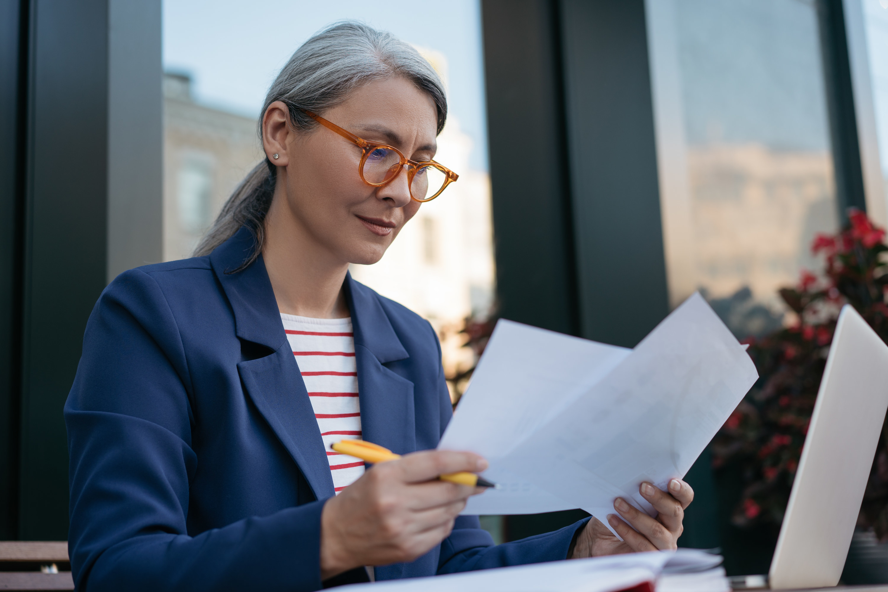 Businesswoman looking at paperwork