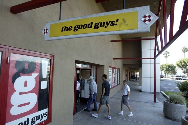 Exterior of a The Good Guys! store with shoppers walking in