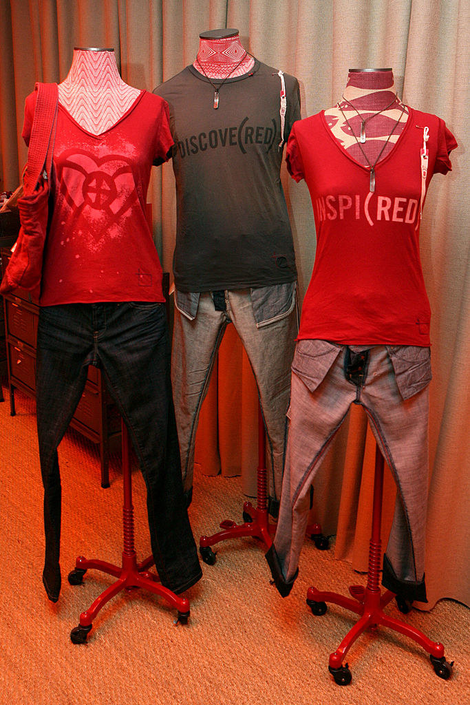 Three different mannequins dressed in Gap red clothing
