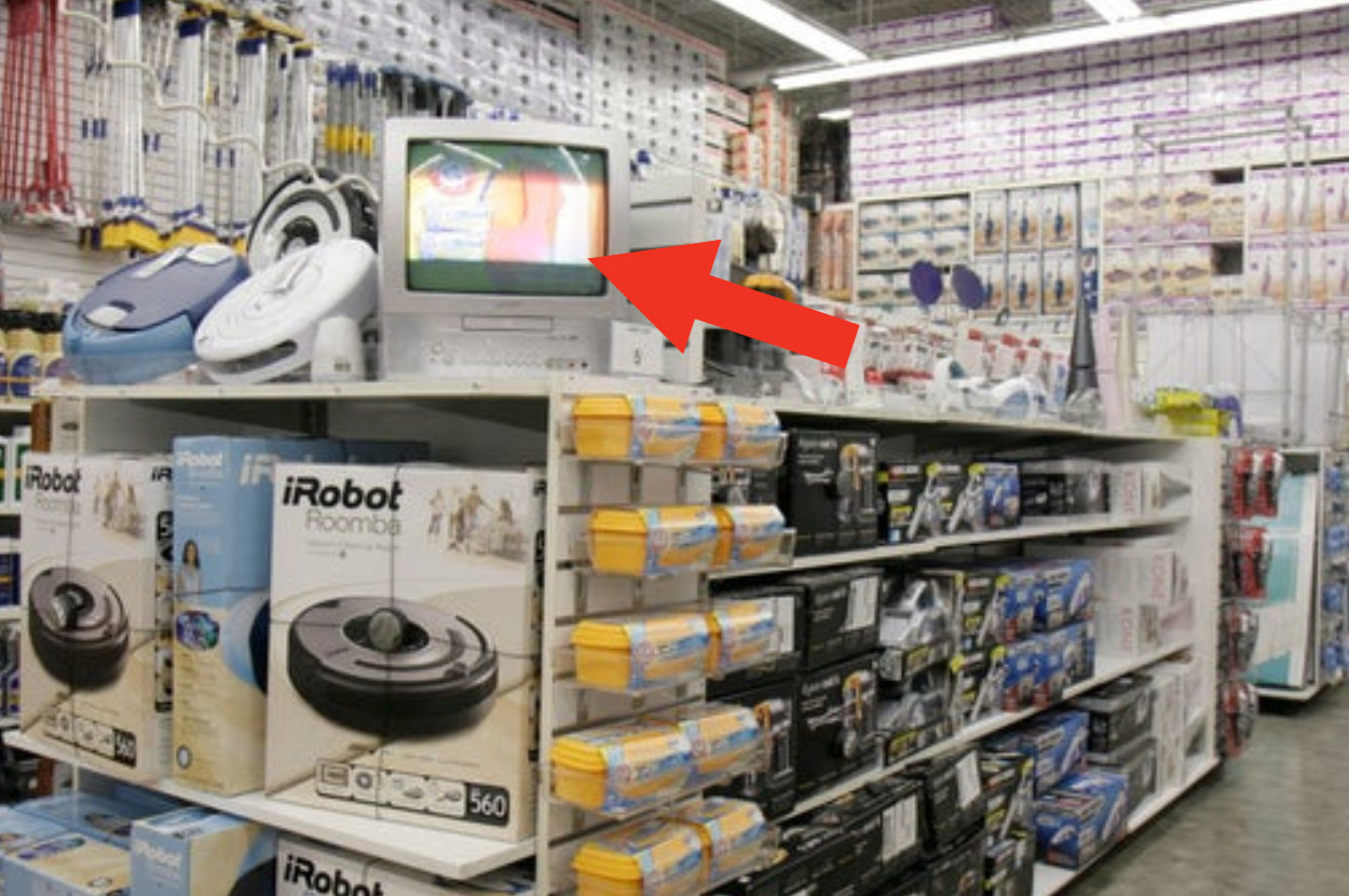 Merchandise display inside Bed Bath and Beyond with a TV on the top of it