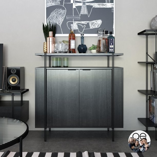 the bar cart in black with two cabinet doors and one shelf