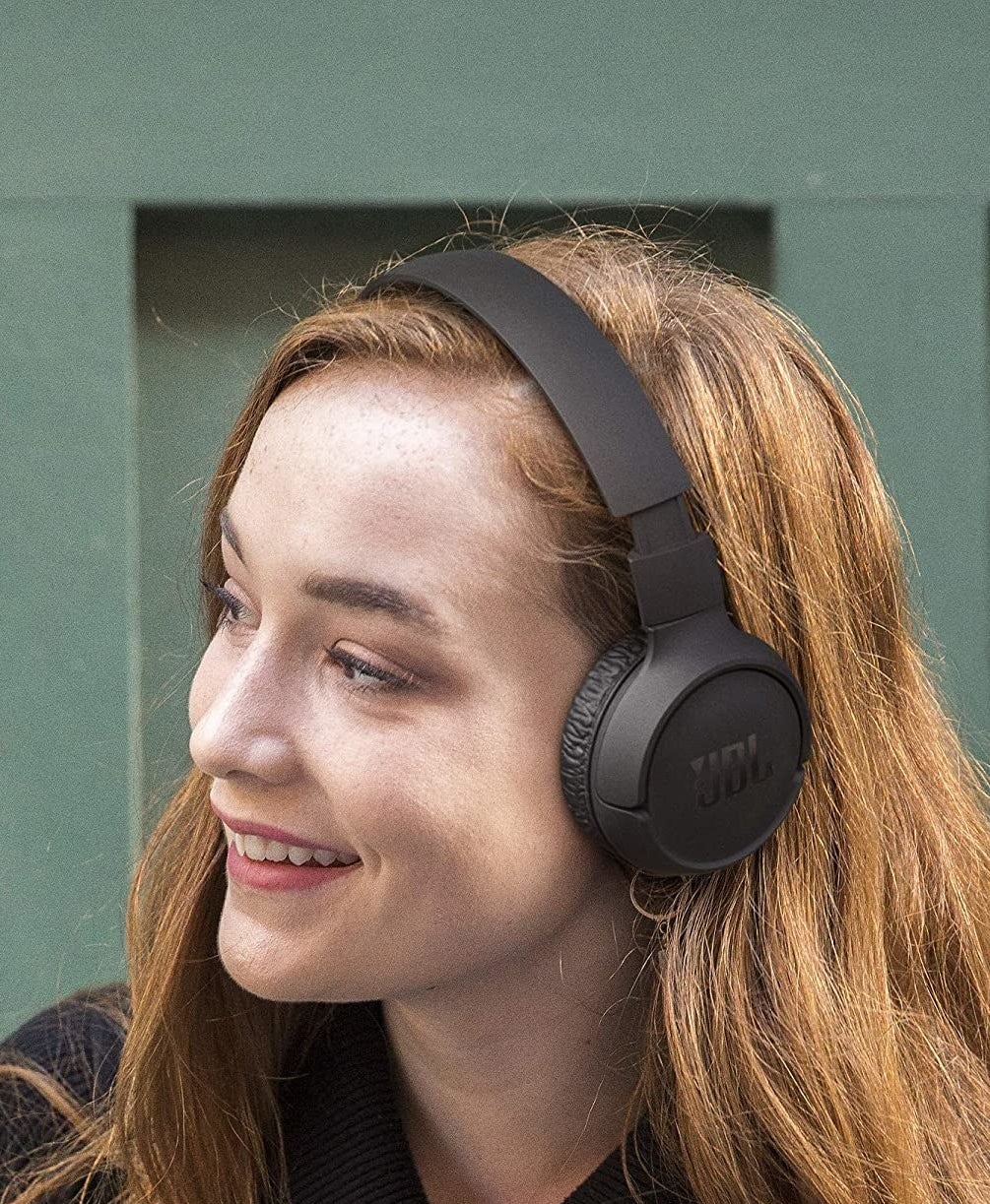 A person wearing over-ear headphones