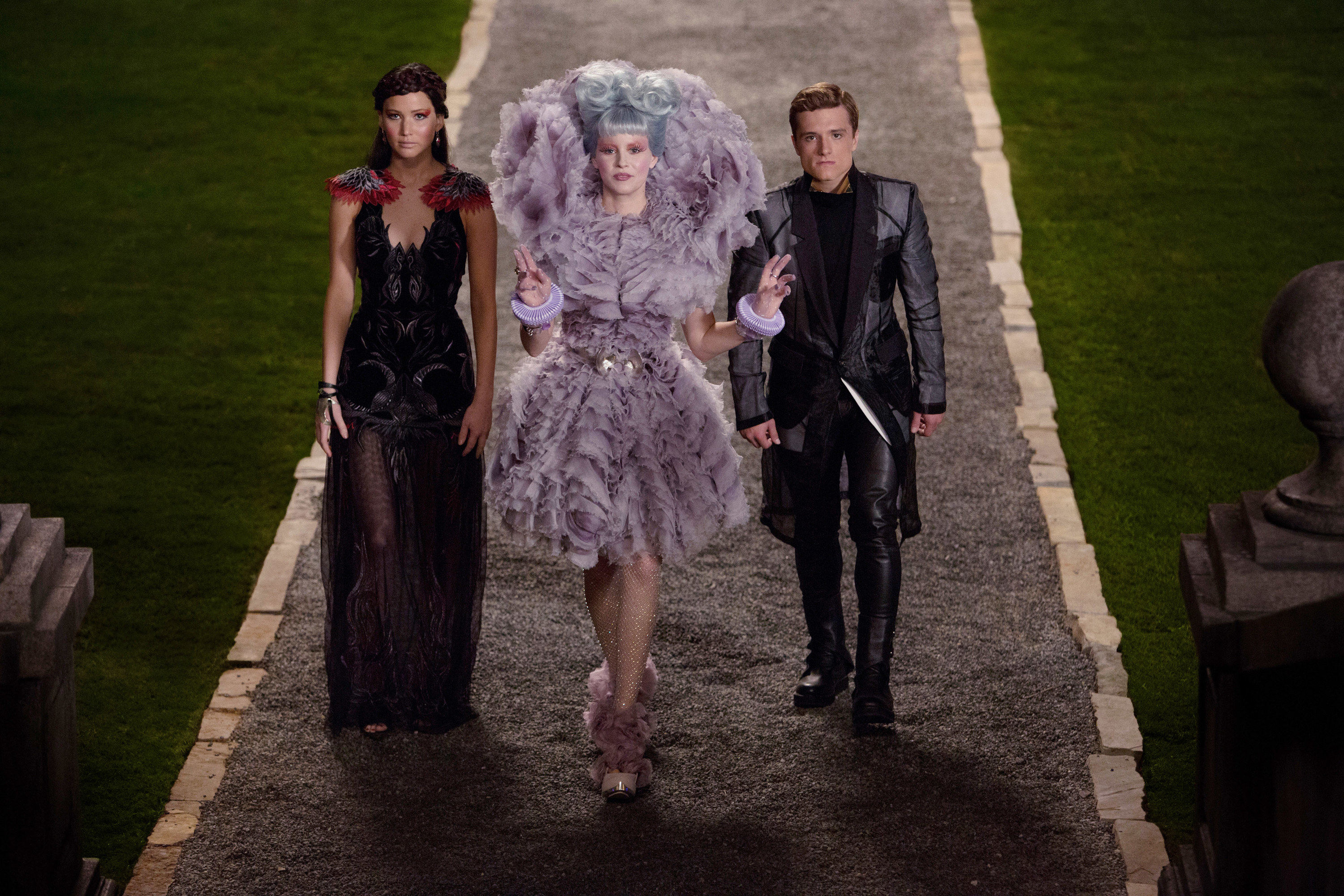 Katniss, Effie, and Peeta walking