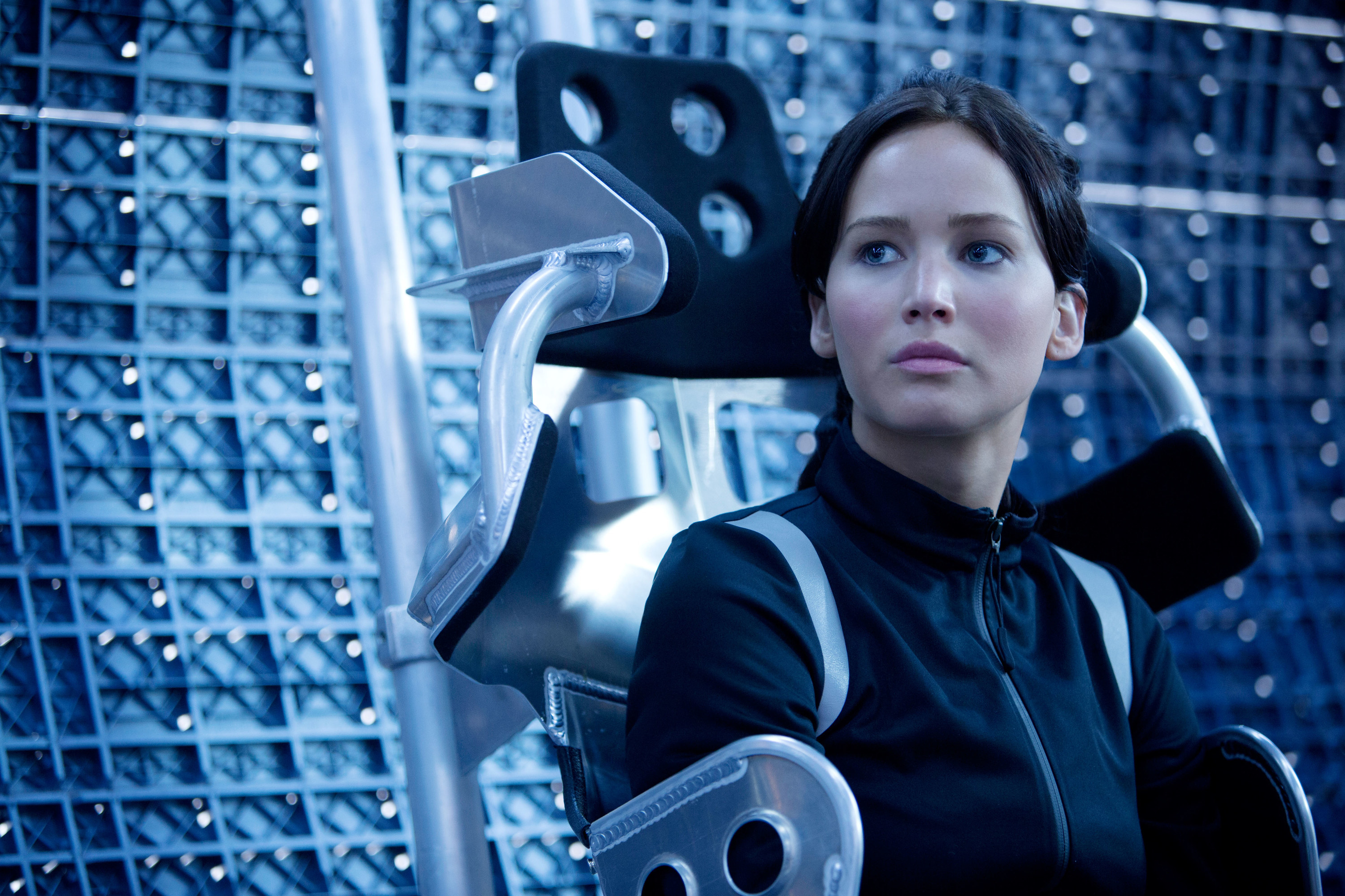 Katniss seated and looking sideways