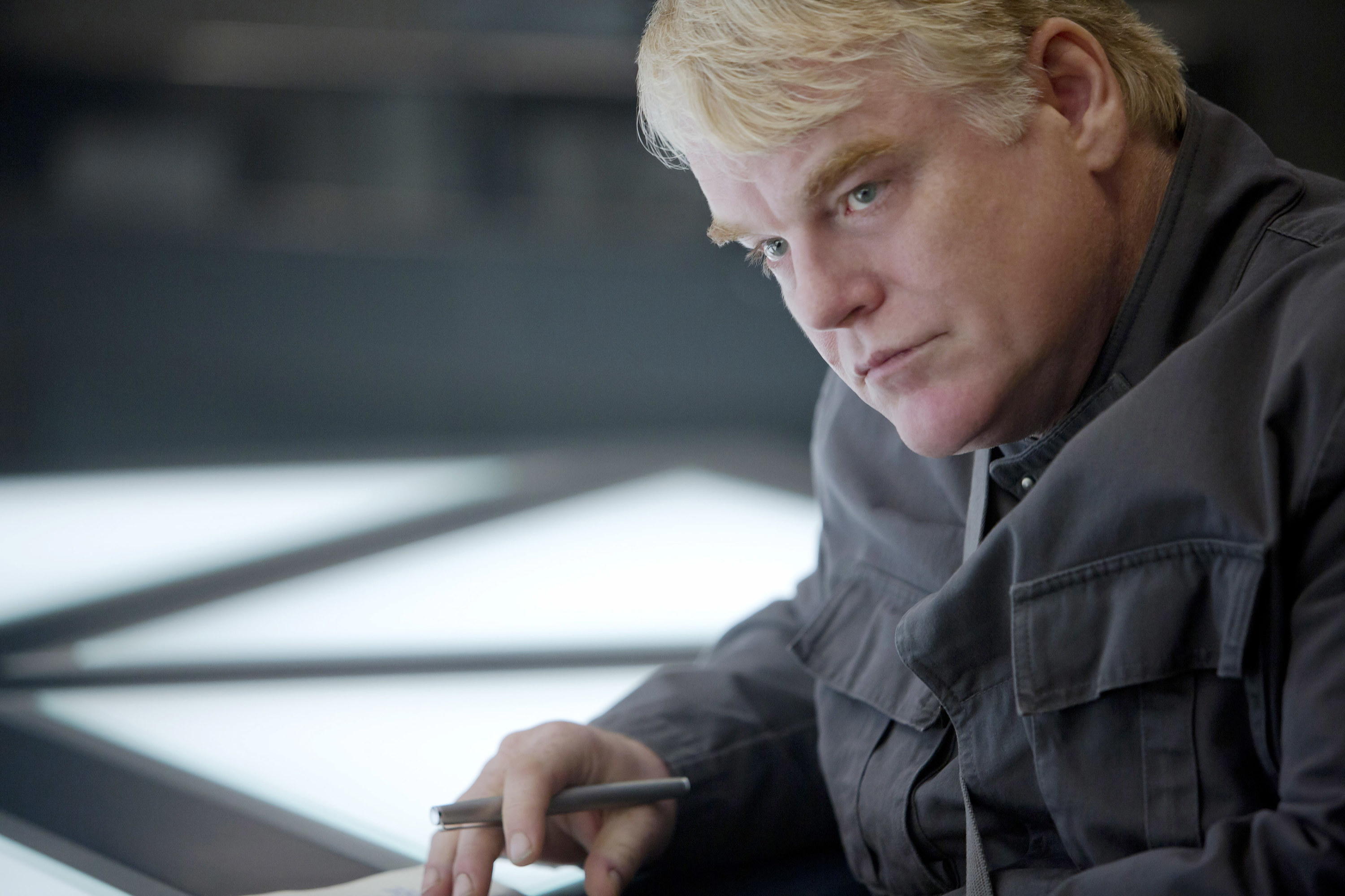 Philip as Plutarch Heavensbee looks serious