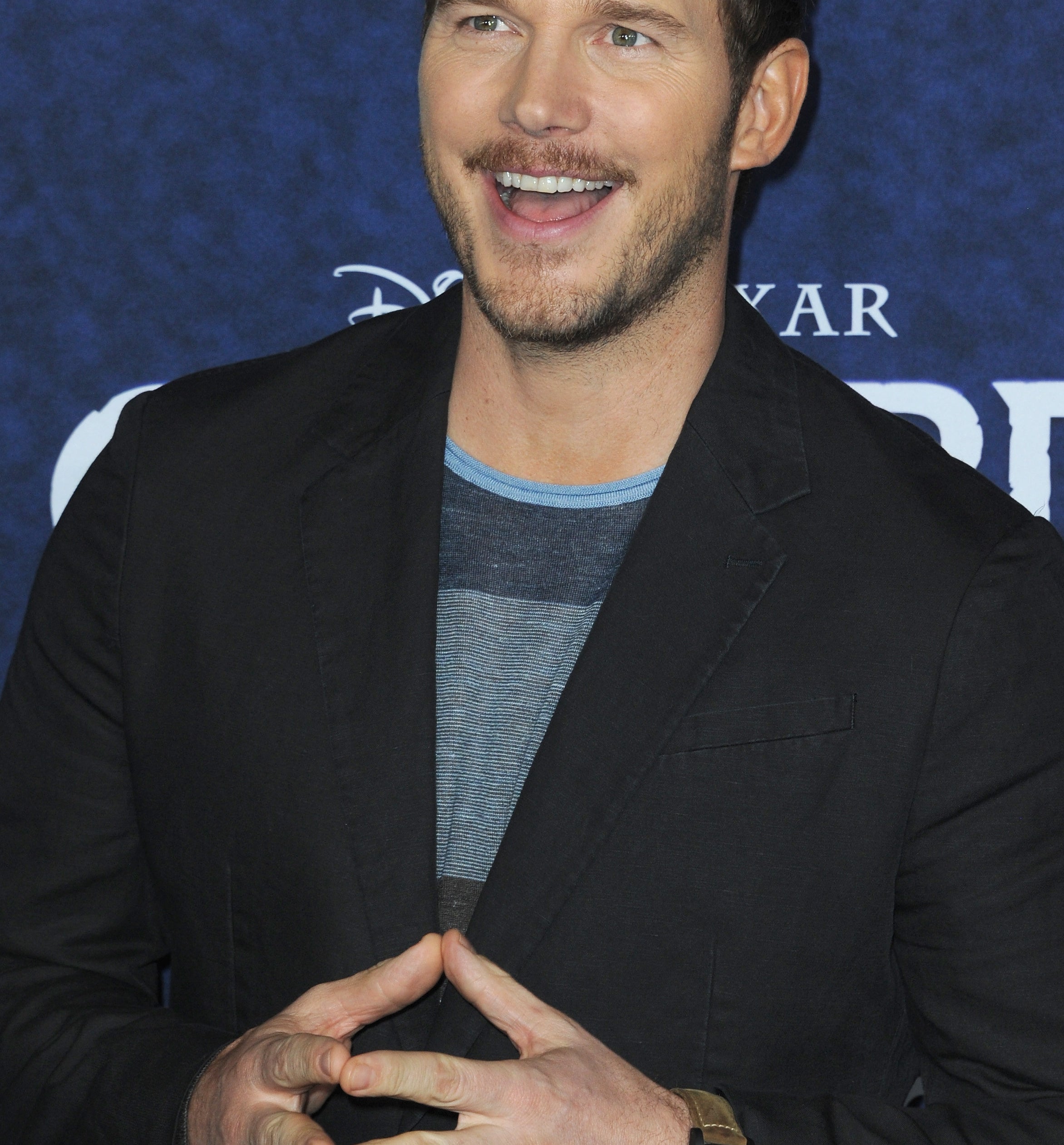 Chris Pratt laughing at an event in 2011