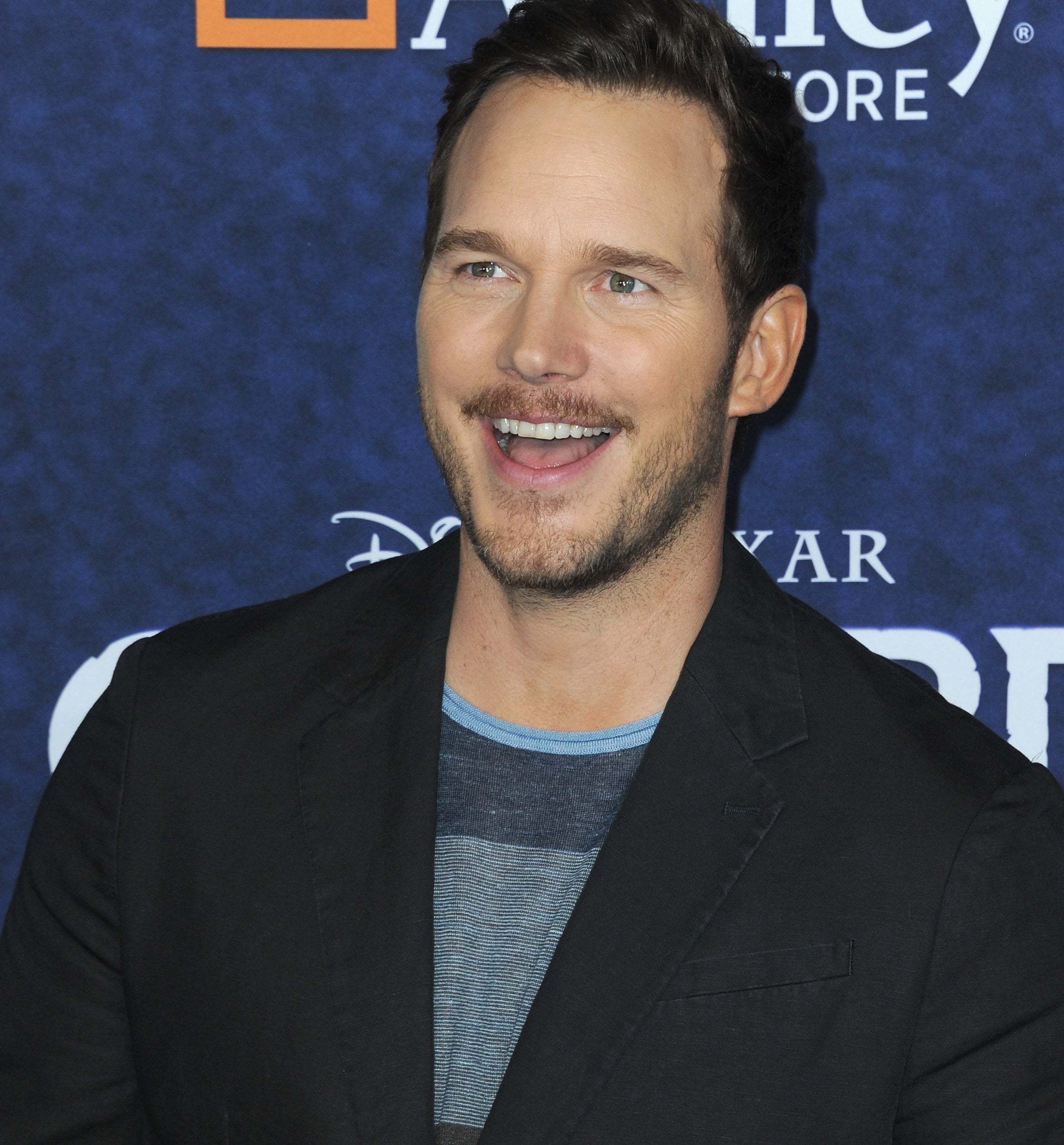 Chris Pratt laughing at an event in 2011