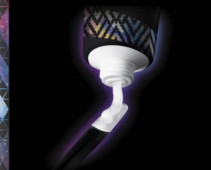 A tube of whitening treatment squeezing out the whitening on an applicator