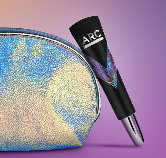 ARC® On-The-Go whitening product leaning against a makeup bag