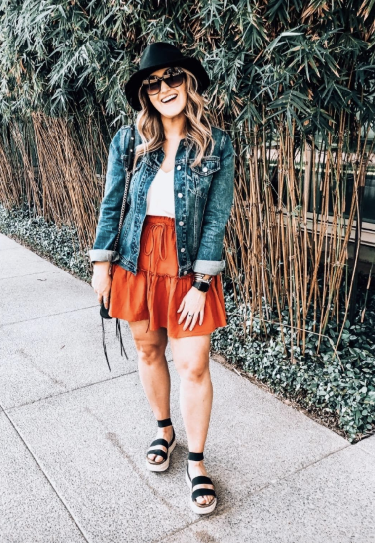 a reviewer wearing the skirt in orange