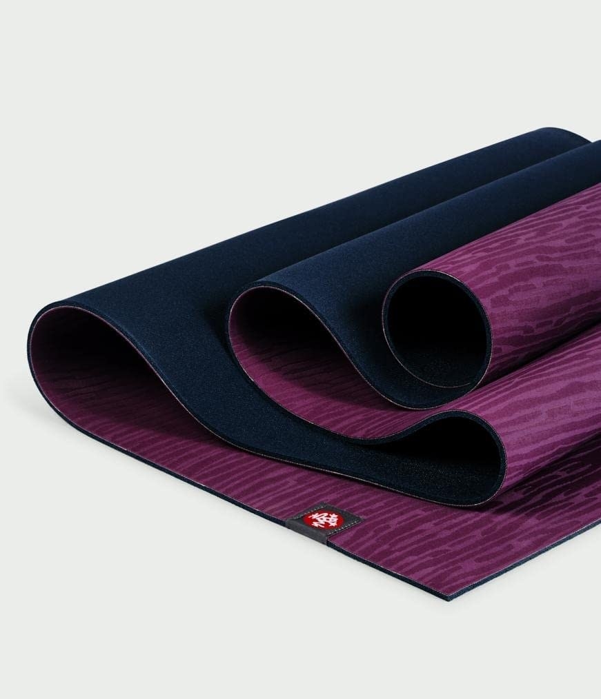 unfurling yoga mat with pretty abstract design on it
