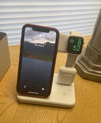 Reviewer's phone placed on wireless charger
