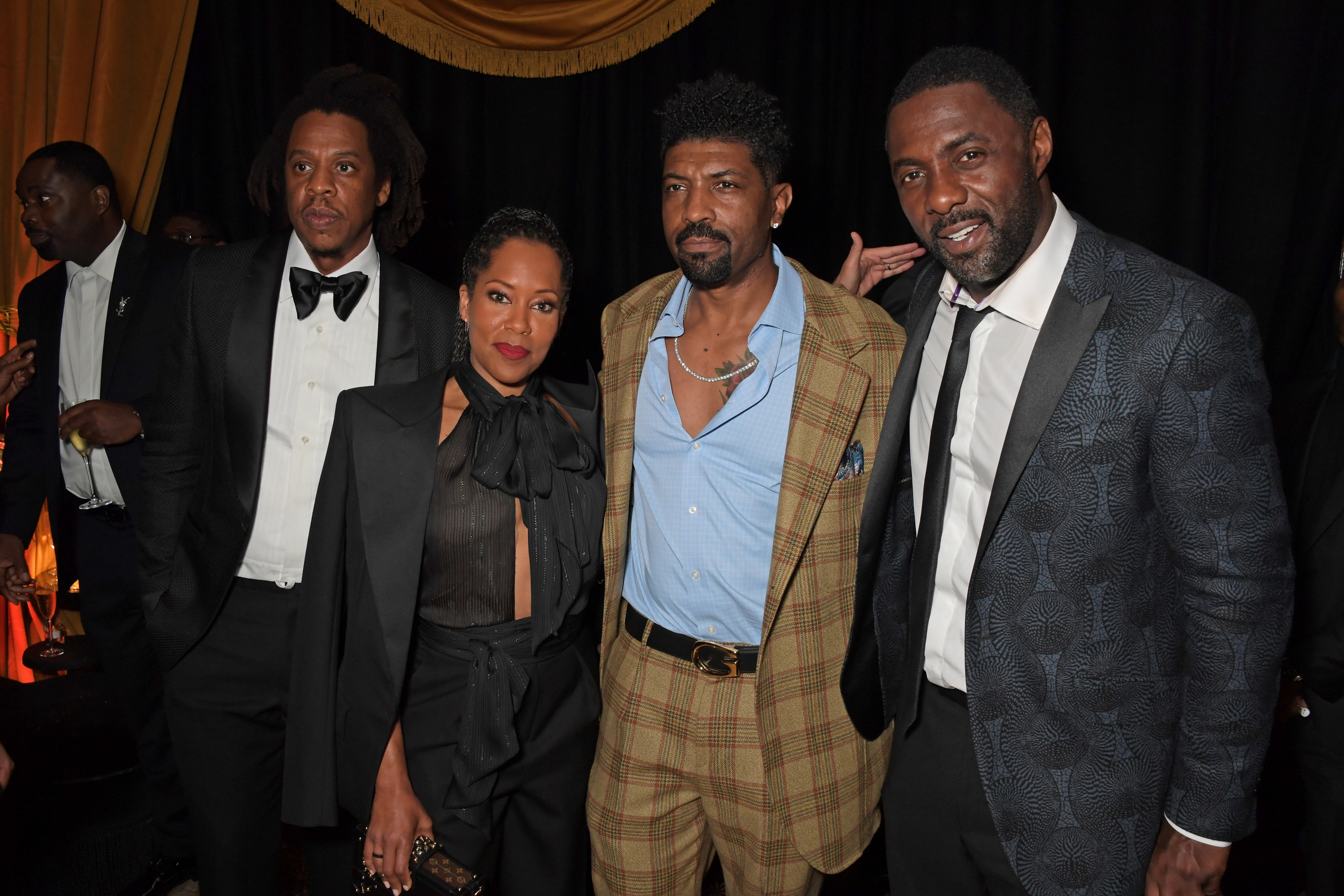 Jay-Z, Regina King, Deon Cole, and Idris Elba pose for a photo together at a Hollywood event