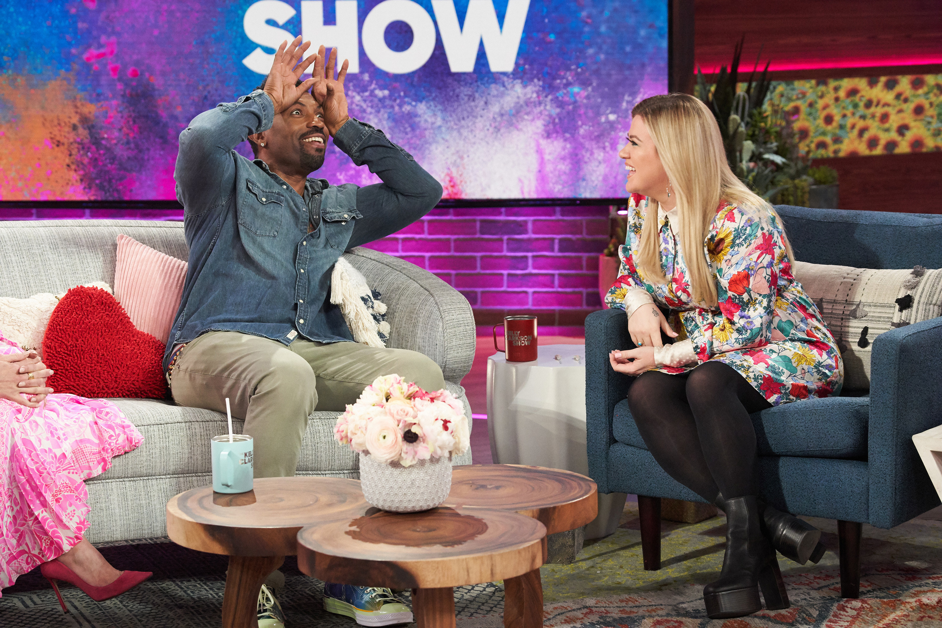 Deon Cole and Kelly Clarkson laugh together on the set of &quot;The Kelly Clarkson Show&quot;