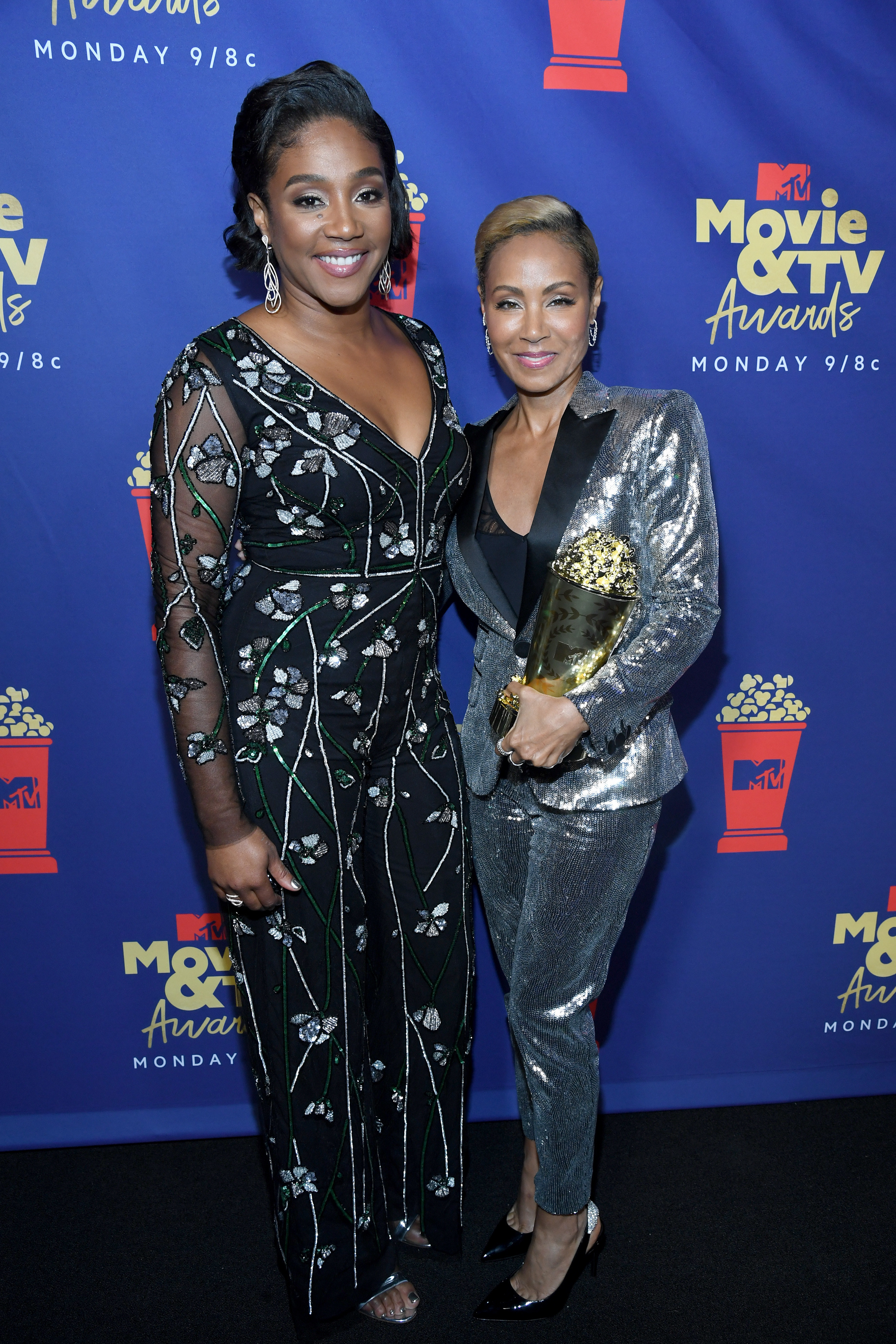 Tiffany Haddish and Jada Pinkett Smith pose together as they arrive at the 2019 MTV Movie and TV Awards