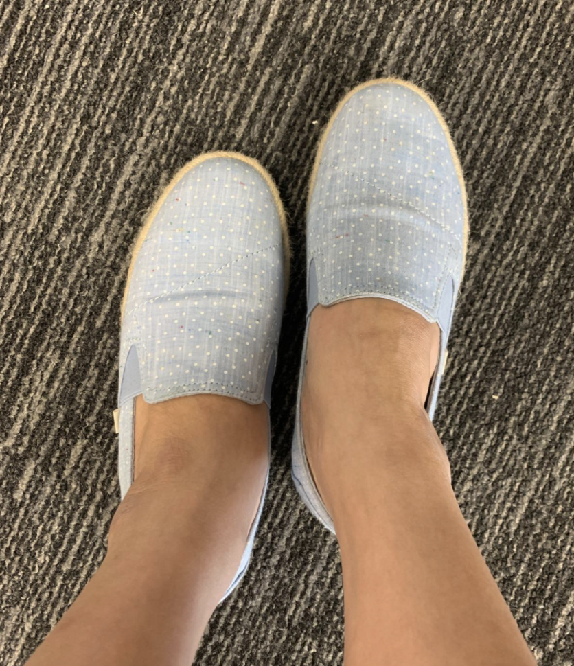 a reviewer photo of the loafers in light blue polka dot