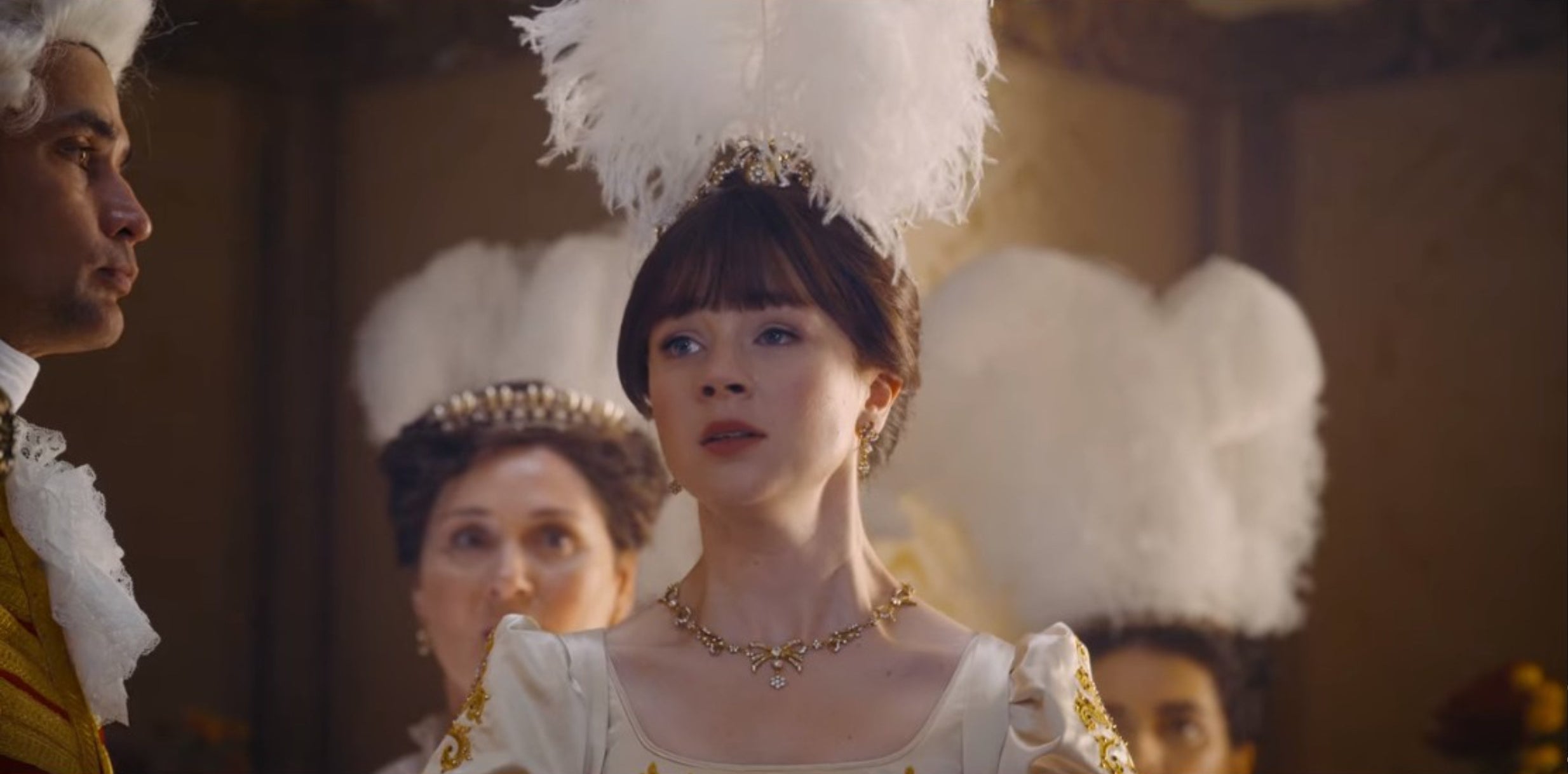 Eloise Bridgerton with a feather on her head when she is presented to the Queen during her debut.