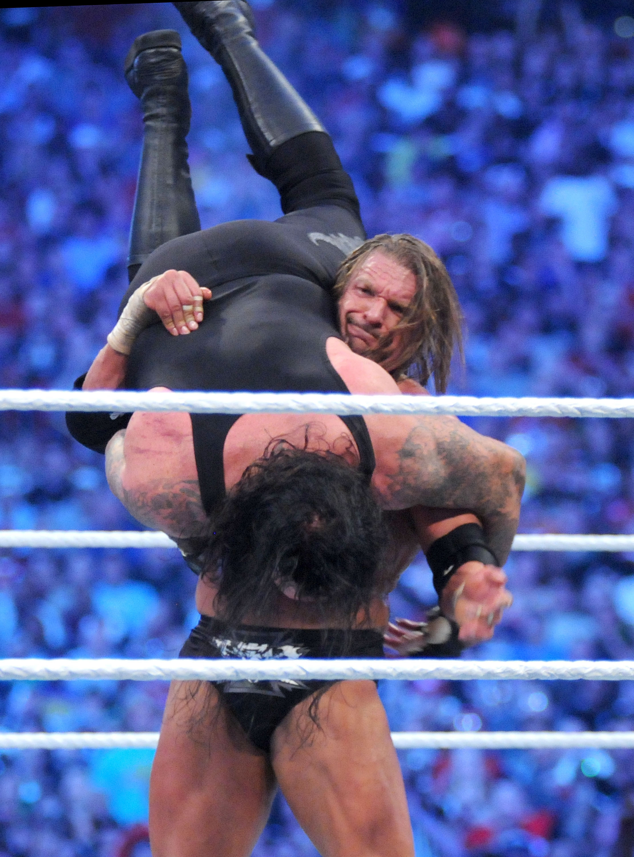 Triple H hitting a tombstone pile driver on UnderTaker