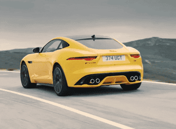 Jaguar driving around a curve