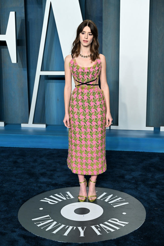 Daisy in a light-colored print, mid-calf dress