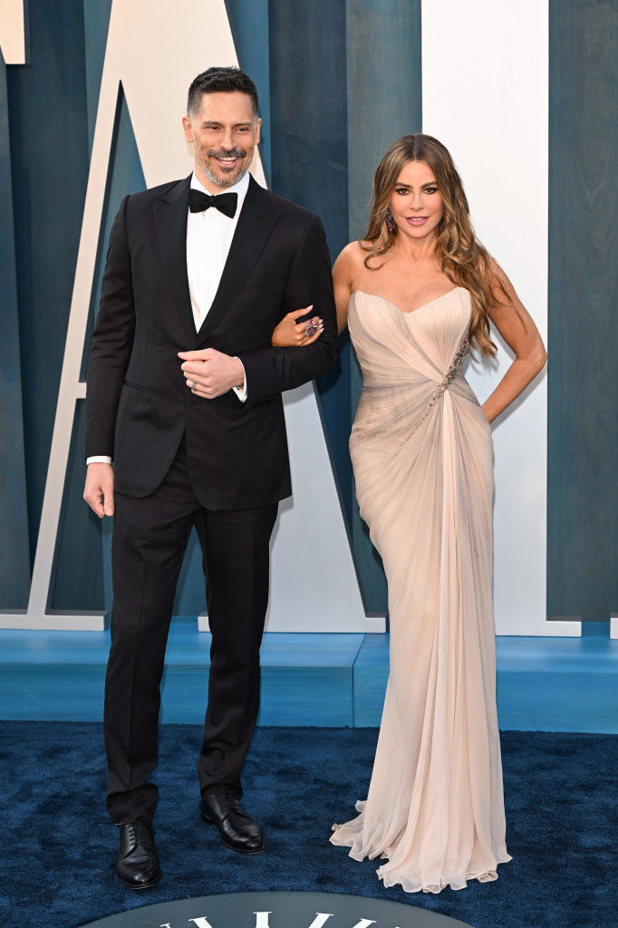 Smiling Joe in a bow tie with smiling Sofía in a long gown