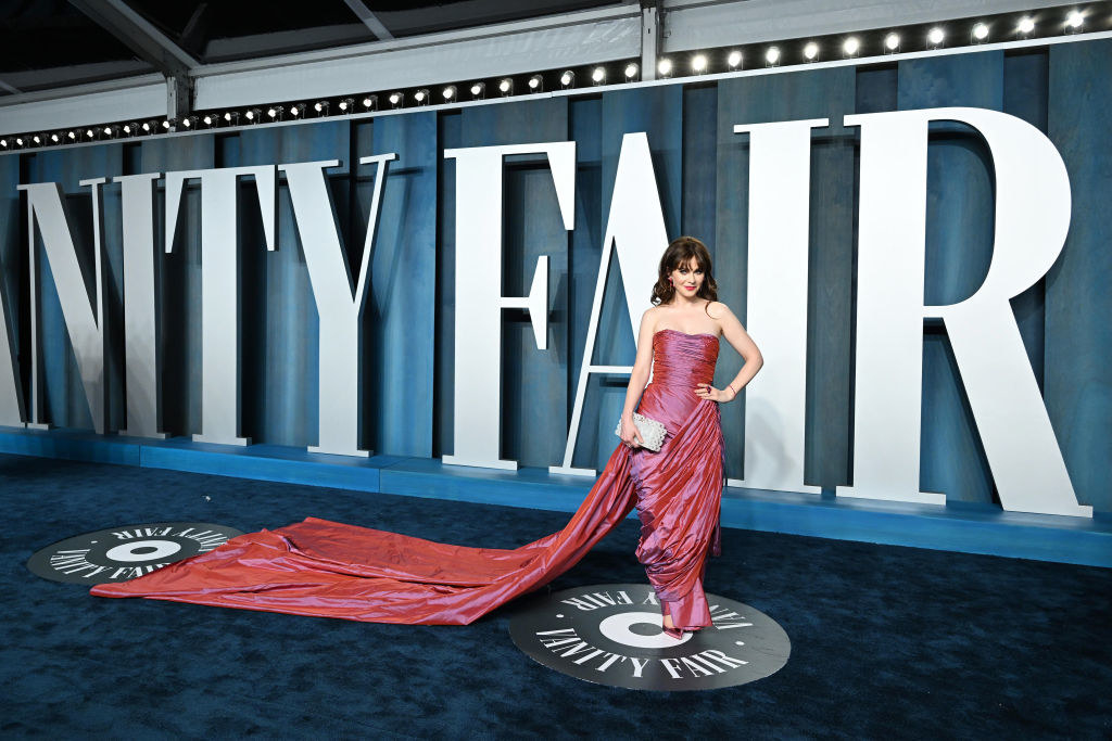 Zooey in a long strapless gown with long train