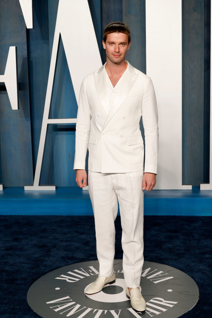 Patrick in a light-colored suit