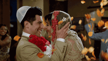 Hannah Simone as Cece Parekh and Max Greenfield as Winston Schmidt getting married in New Girl