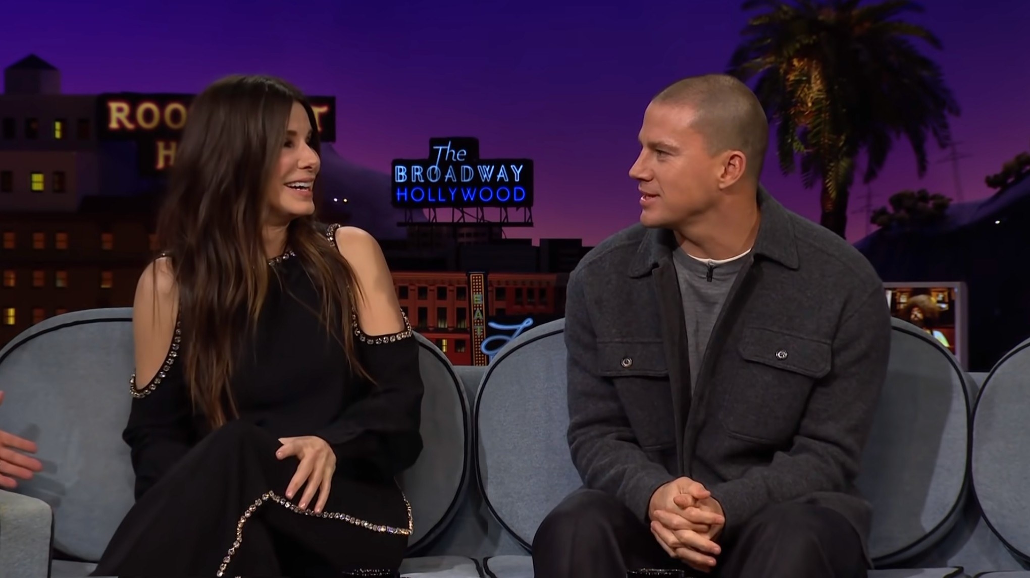 Sandra Bullock and Channing Tatum looking at each other on the James Corden Show