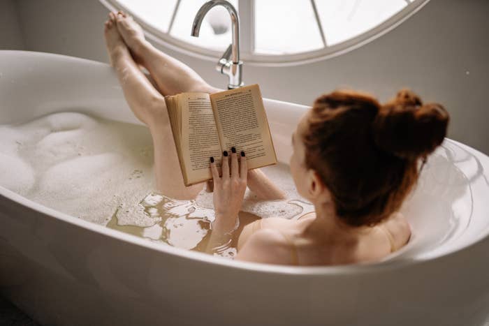 woman in the bathtub reading