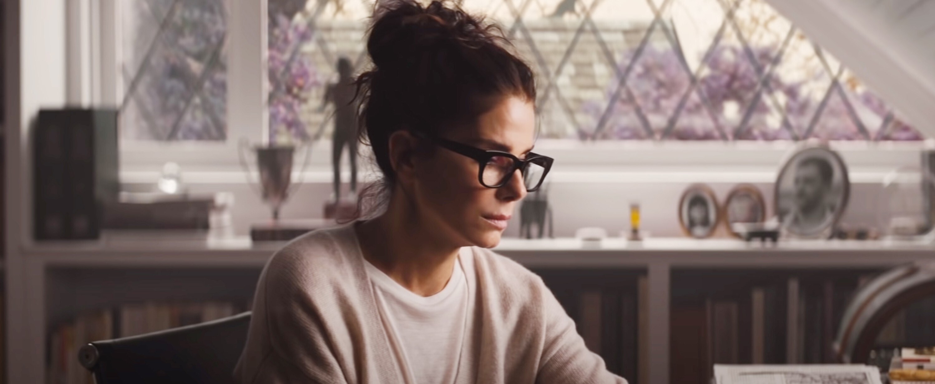 Sandra Bullock wearing glasses in The Lost City