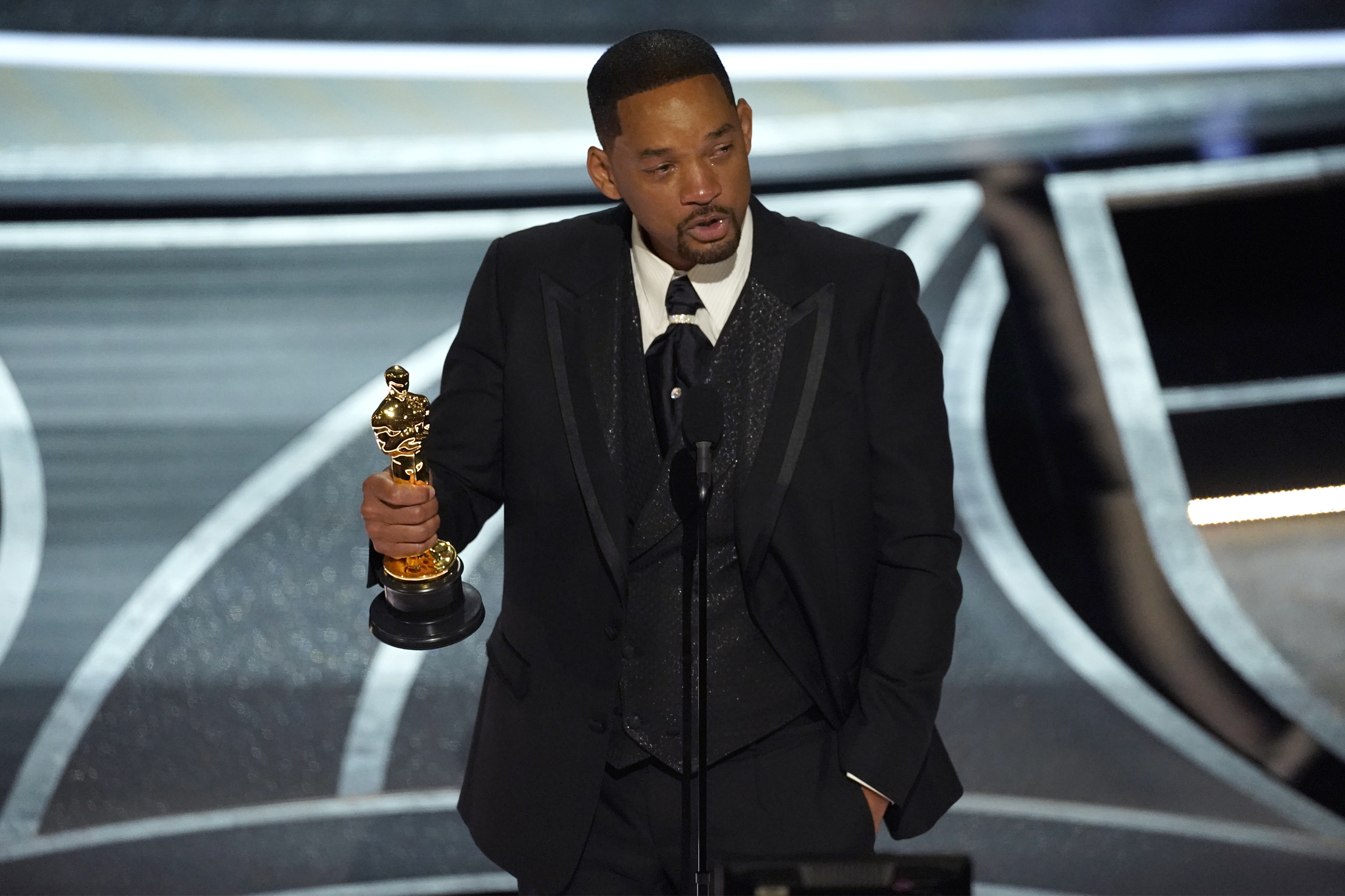 Will Smith tearfully accepts the Oscar for Best Actor.