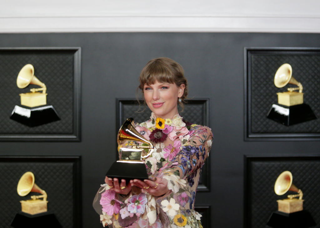 Taylor holding a Grammy Award