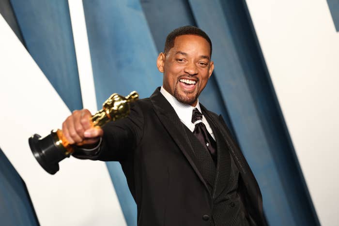 Will smiling and holding up his award