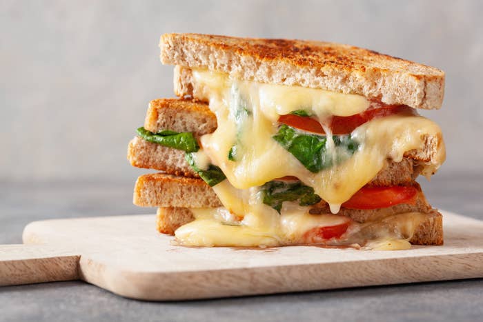 Grilled cheese spinach and tomato sandwich
