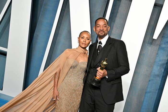 Jada standing next to Will, who holds his Oscar