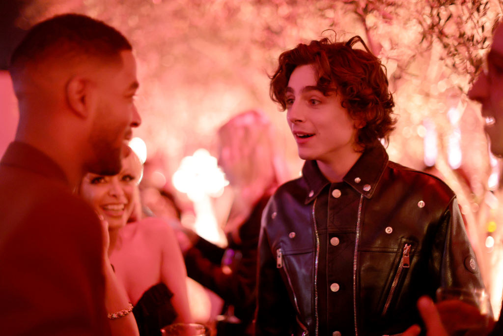 Cudi smiles at Timothée, who looks stunned