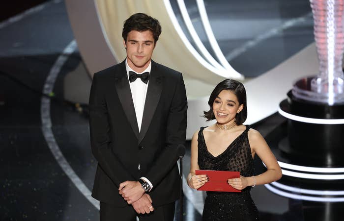 Jacob and Rachel stand together onstage, with a very big height difference