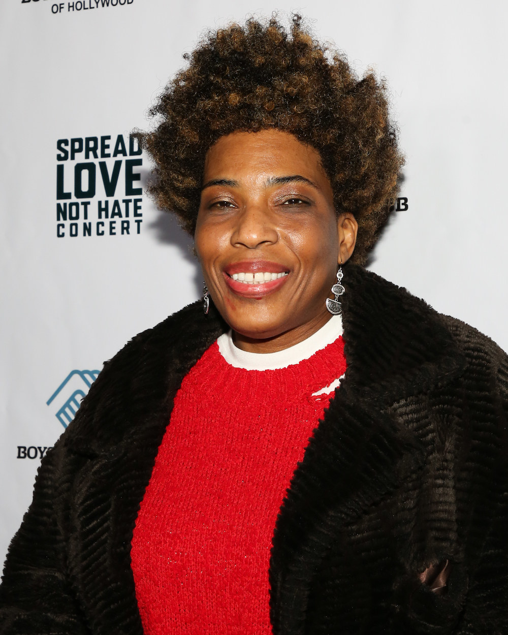 close up of Macy Gray wearing a sweater and heavy coat