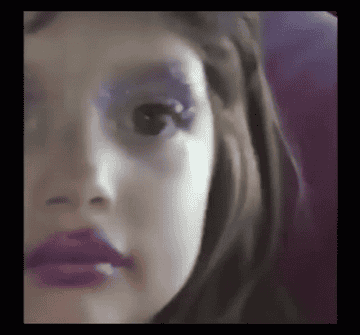 little girl with messy glitter makeup on