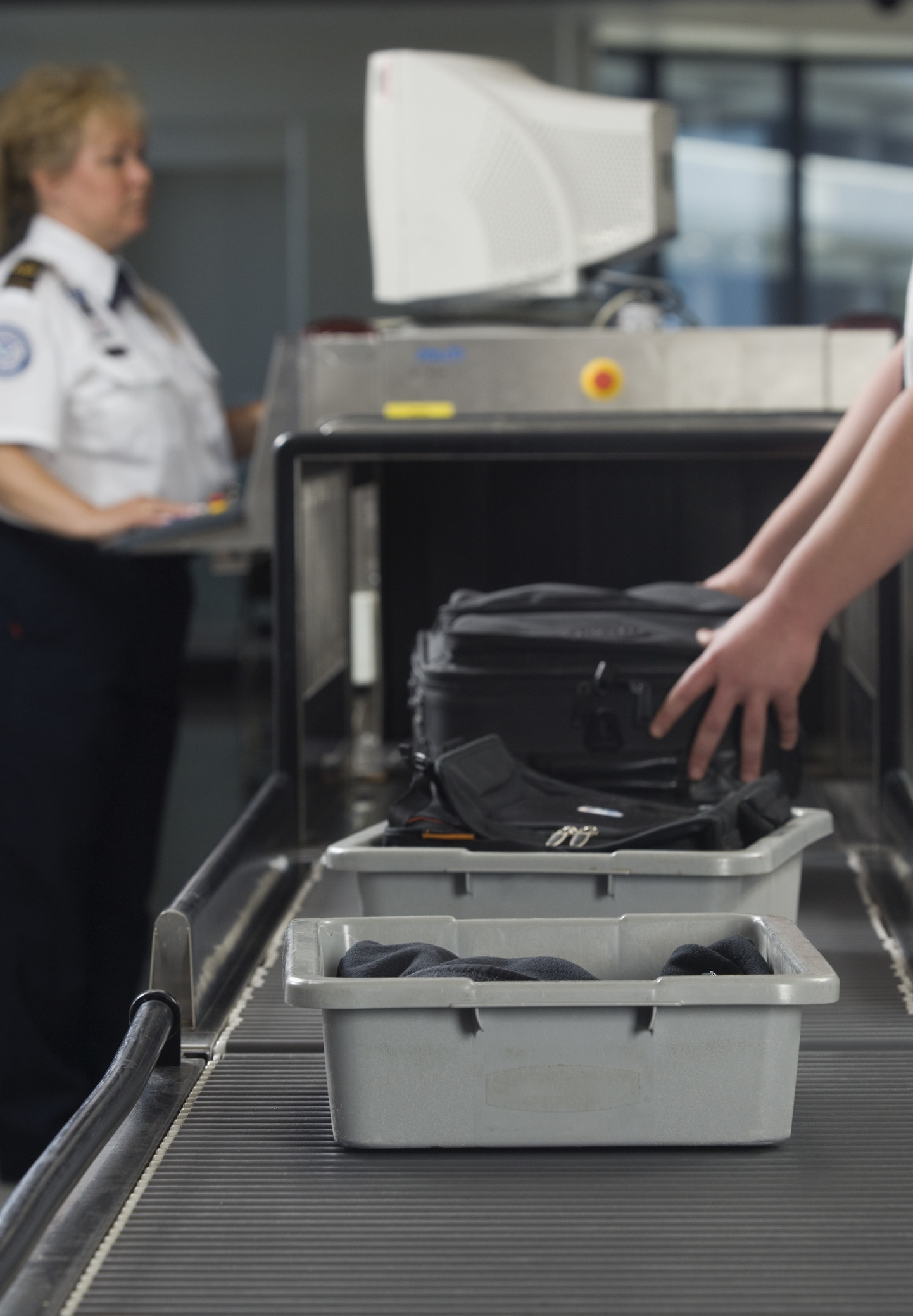 A bag going through airport security.
