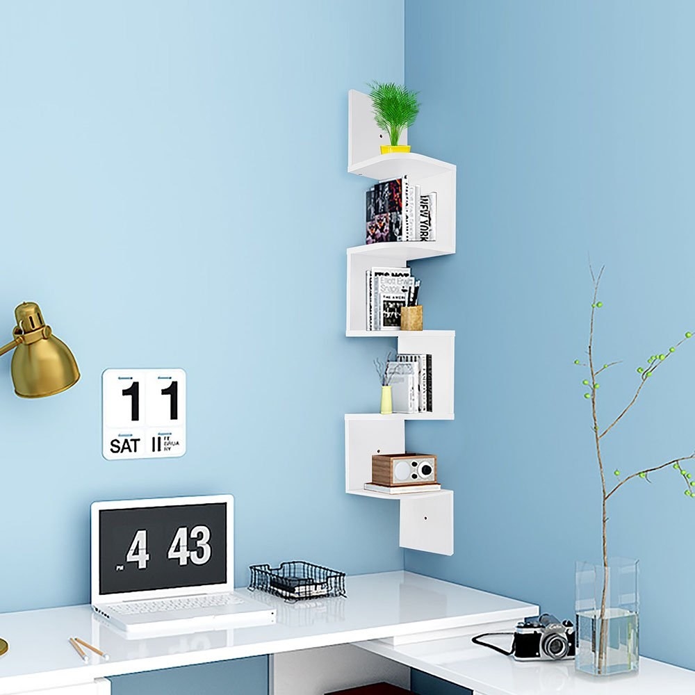 the corner shelf in white over a desk