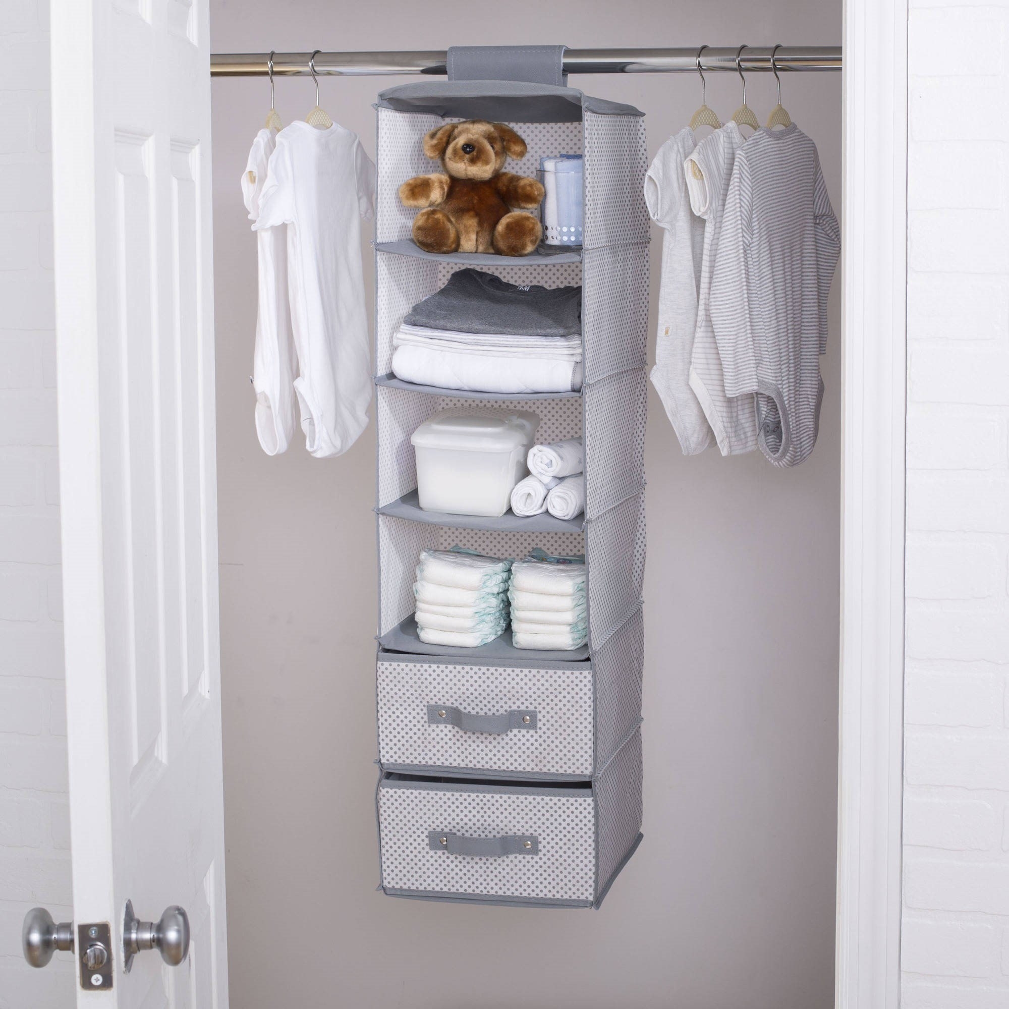 the gray hanging shelf with baby supplies stored inside