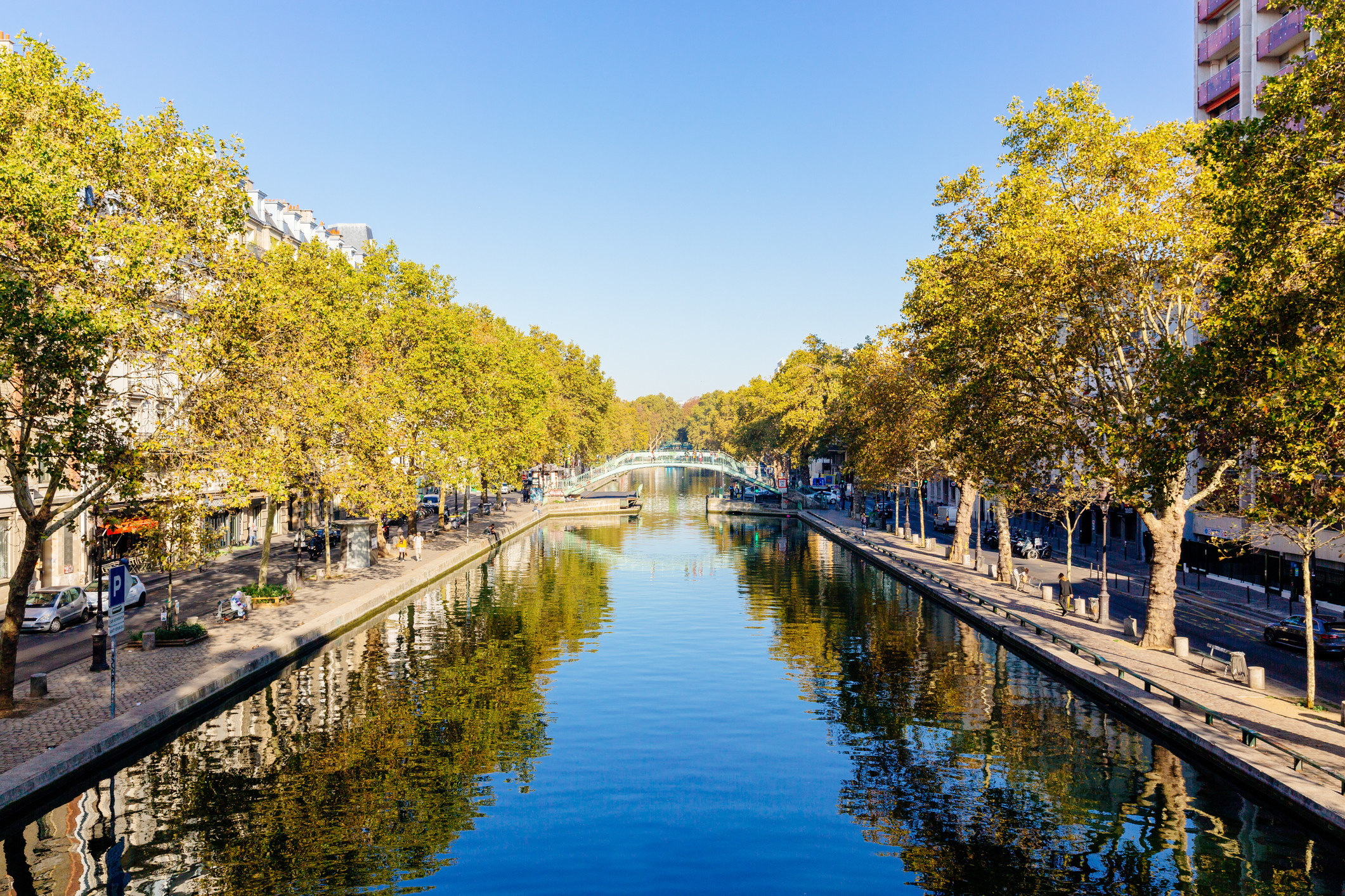 A quiet neighborhood by a canal in Paris.