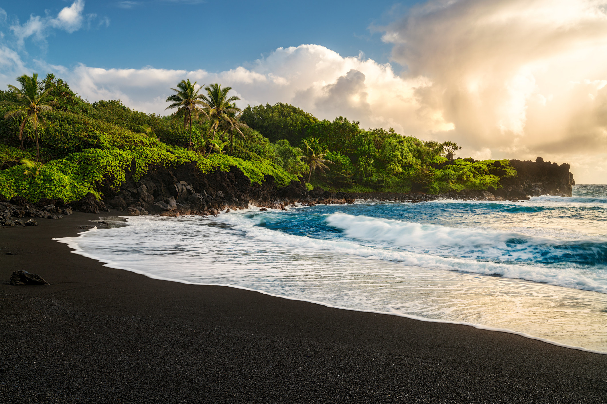 A tropical black sand beach.