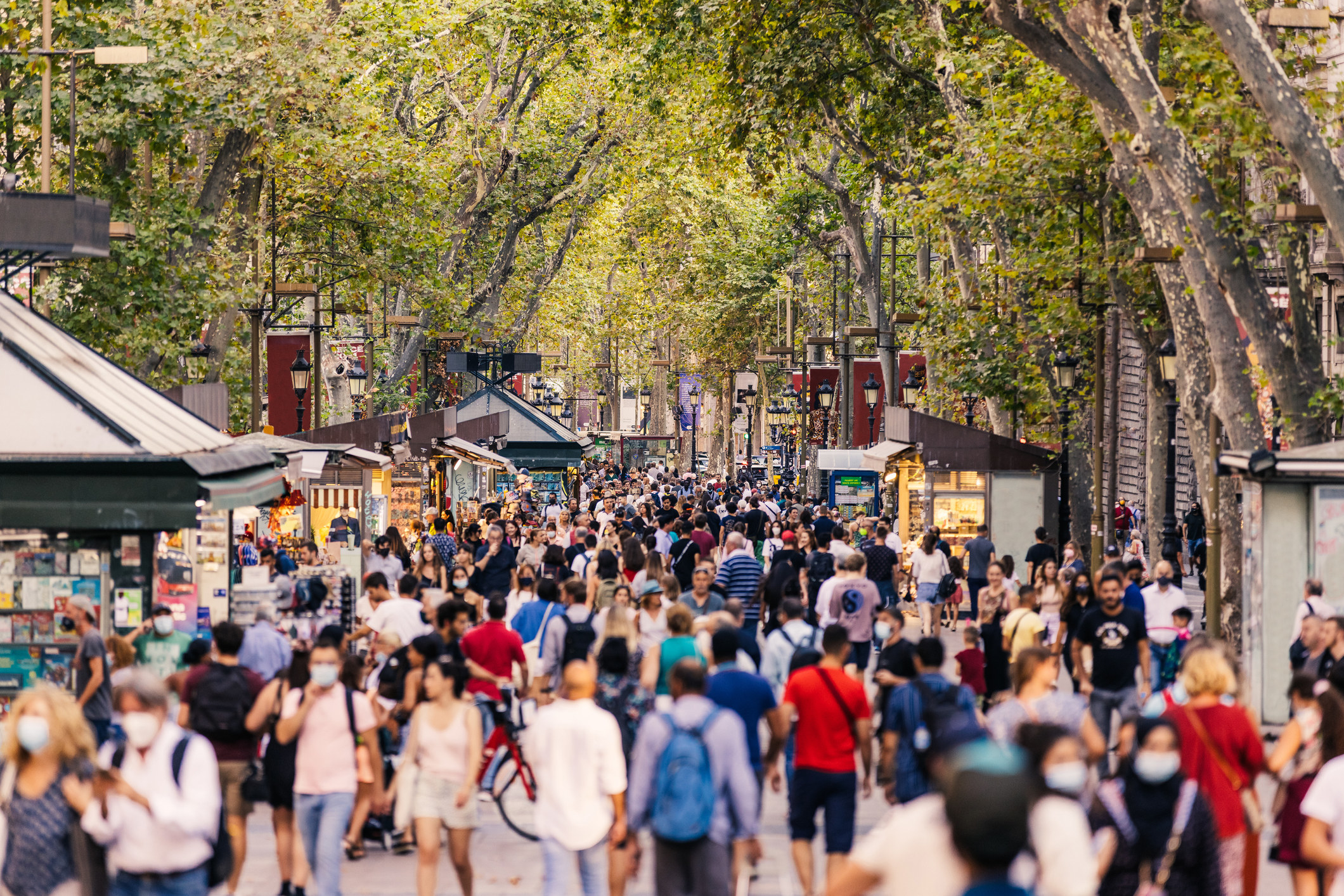 A busy pedestrian street with lots of people