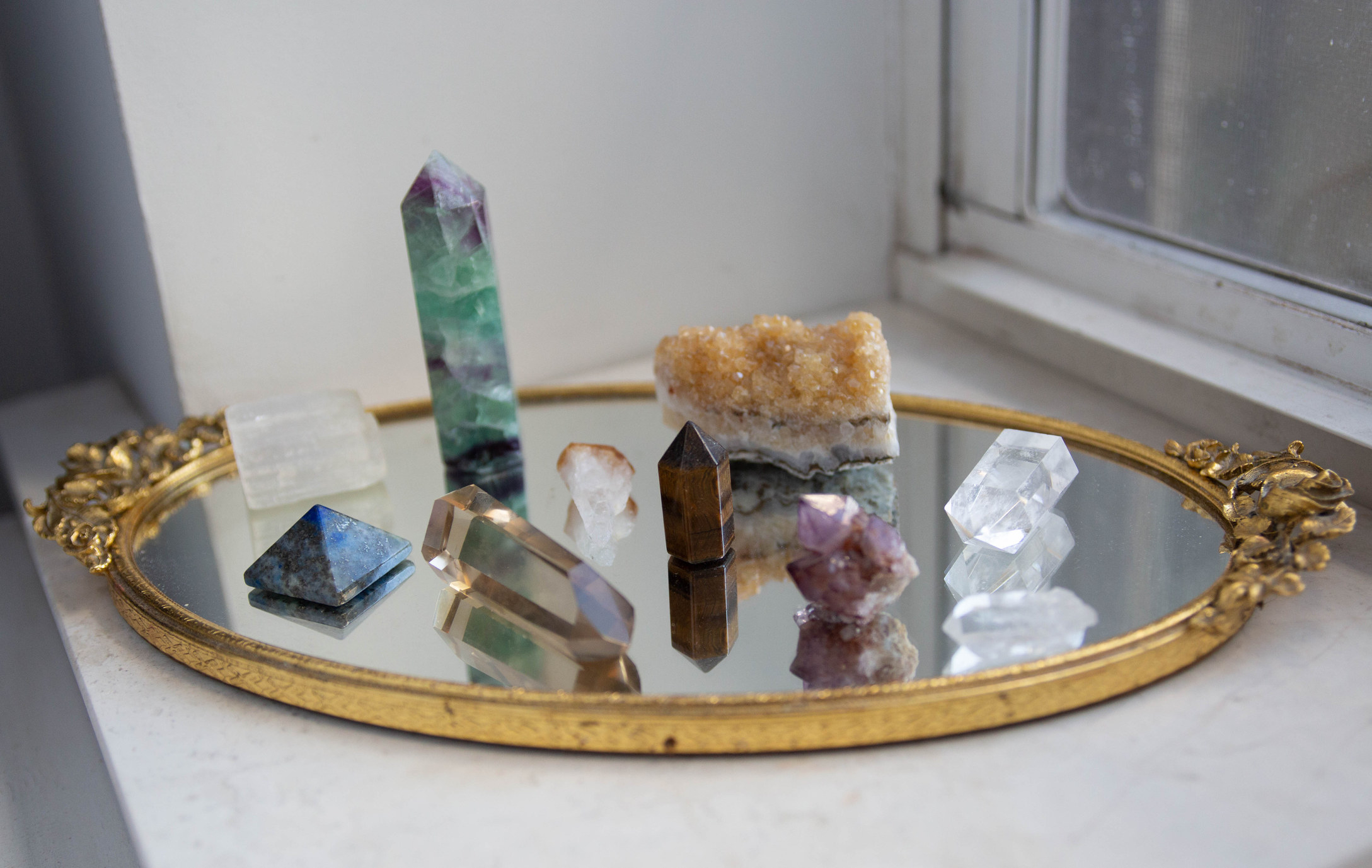 Assortment of crystals on a mirror